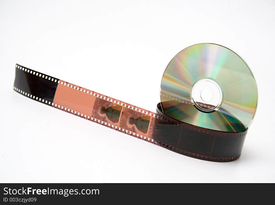 35 mm film and disk on white background. 35 mm film and disk on white background.