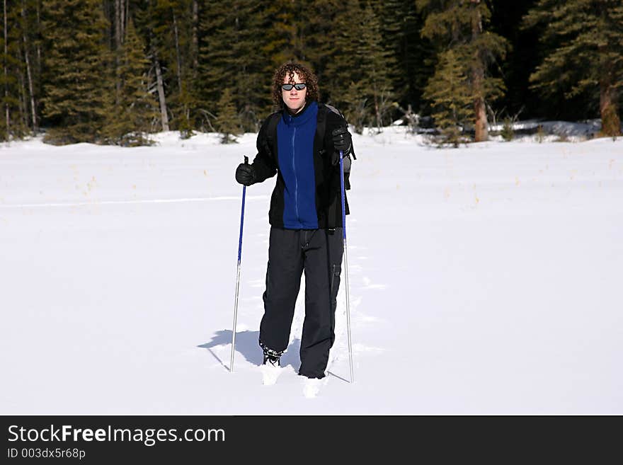 A person cross country-skiing in kanaskis country, canada. A person cross country-skiing in kanaskis country, canada.