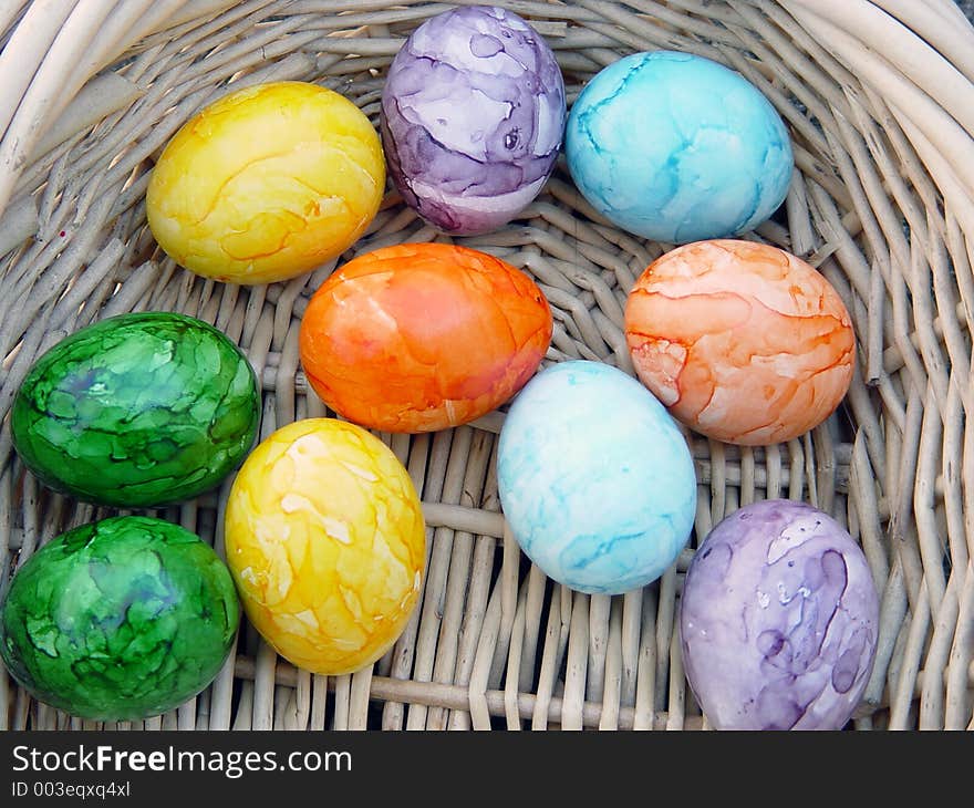 Colored eggs in easter basket