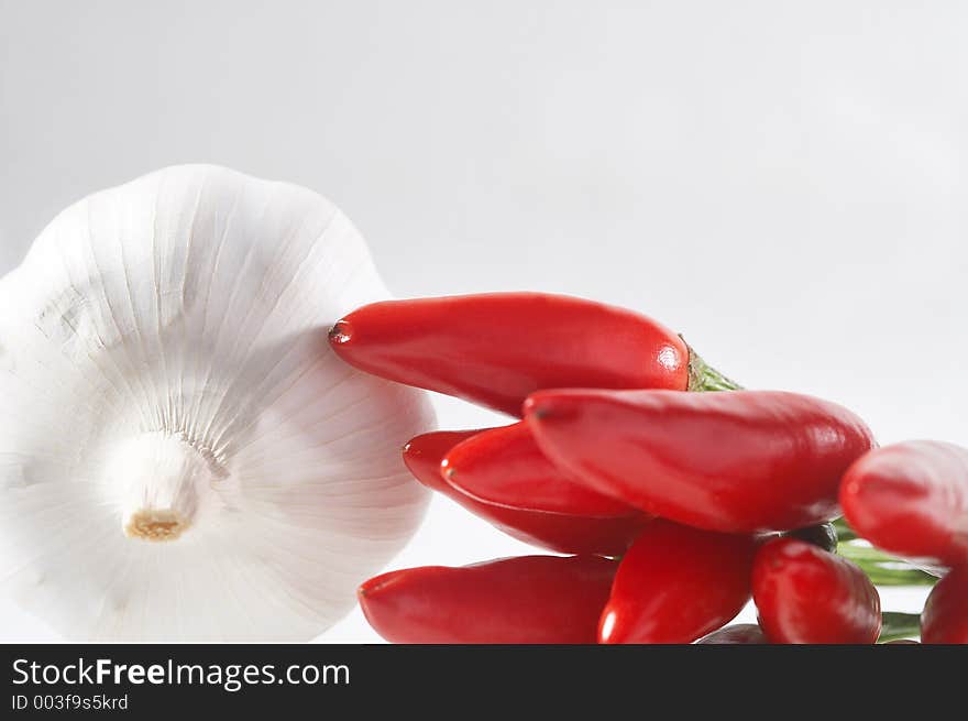 Garlic clove and red chilli - Knoblauchknolle und rote Chilli. Garlic clove and red chilli - Knoblauchknolle und rote Chilli