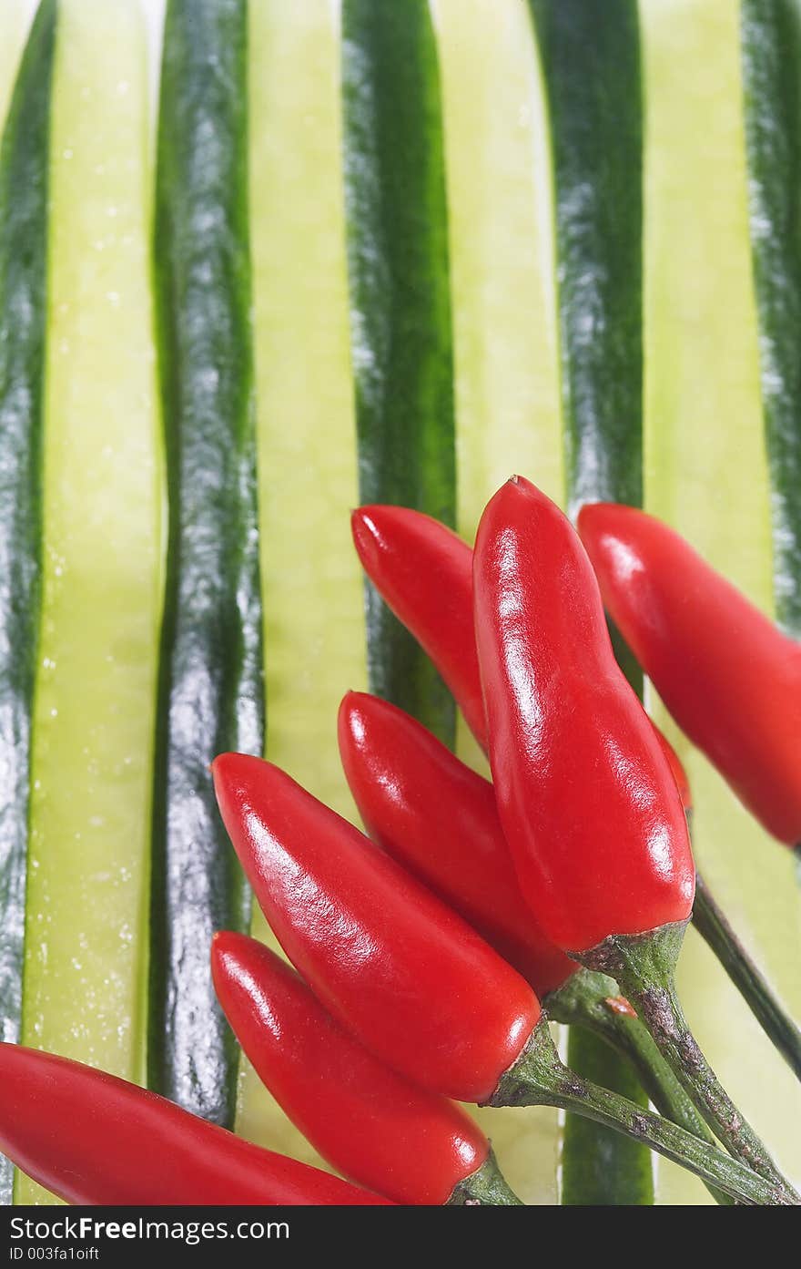 Cucumber slices with red chilli - Gurkenscheiben mit roten Chillischoten. Cucumber slices with red chilli - Gurkenscheiben mit roten Chillischoten