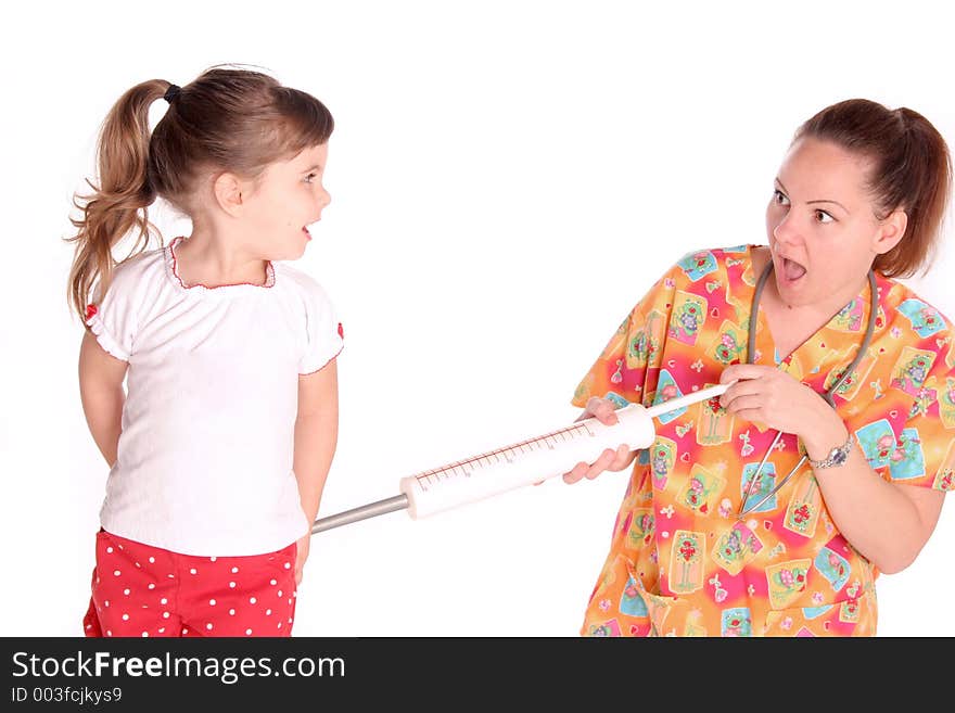 Expression of this nurse as she gives this child a shot as she looks on in surprise. Expression of this nurse as she gives this child a shot as she looks on in surprise