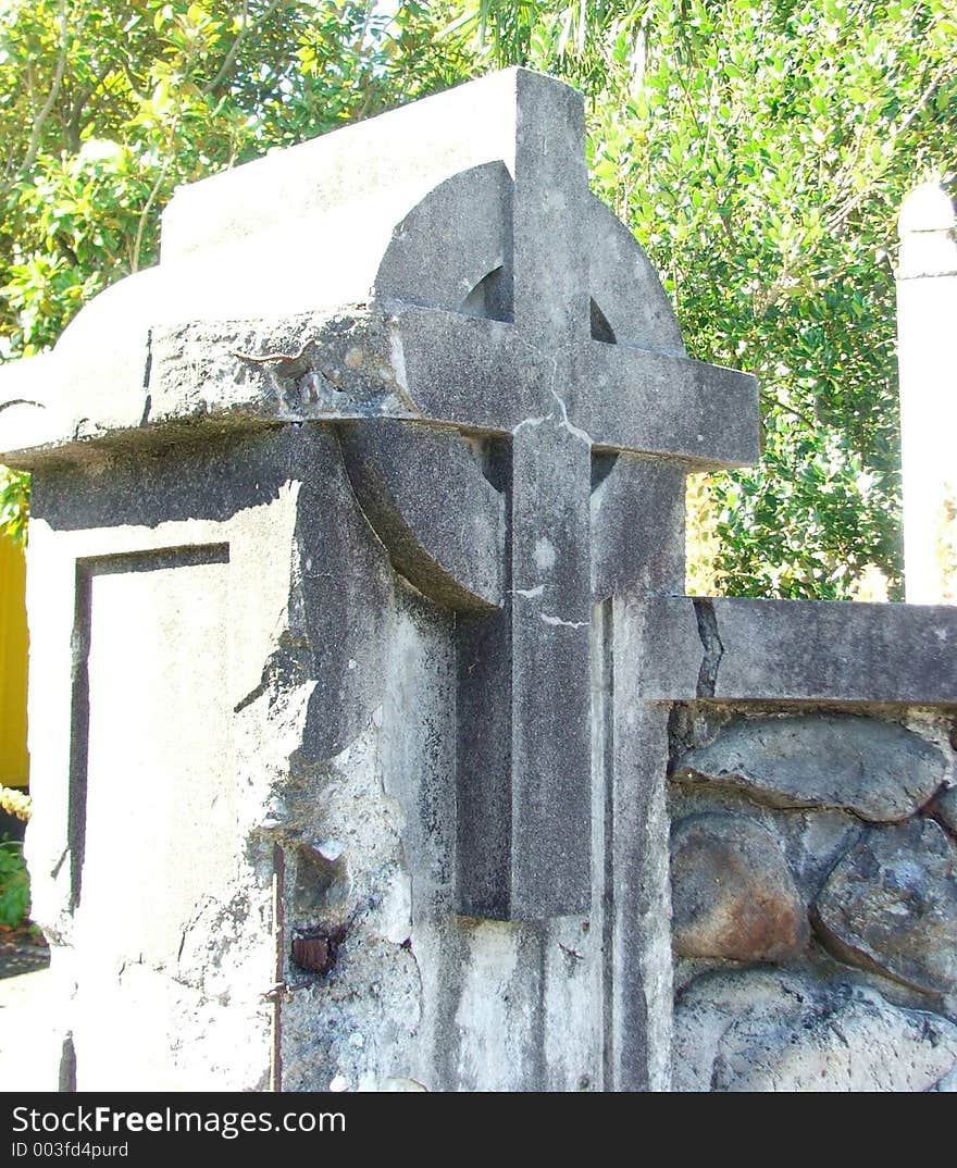 Old concrete gatepost in the form of a crucifix. Old concrete gatepost in the form of a crucifix