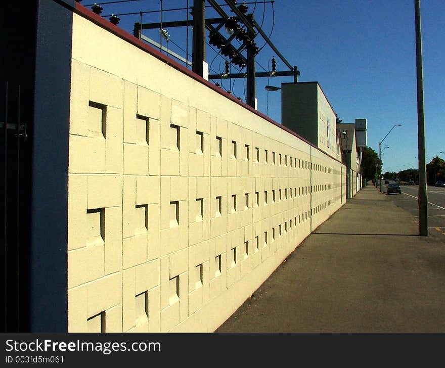 Linear perspective view along a sunlit wall. Linear perspective view along a sunlit wall