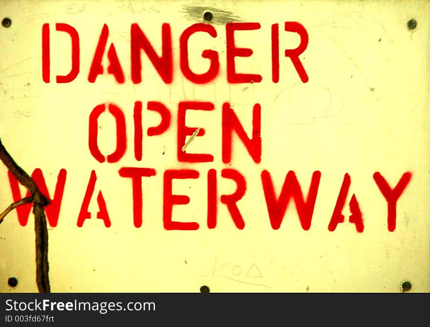 Sign warning of open waterway. Sign warning of open waterway