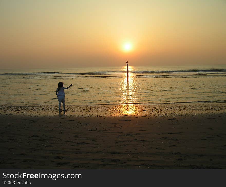 Little girl pointing to the sun. Little girl pointing to the sun