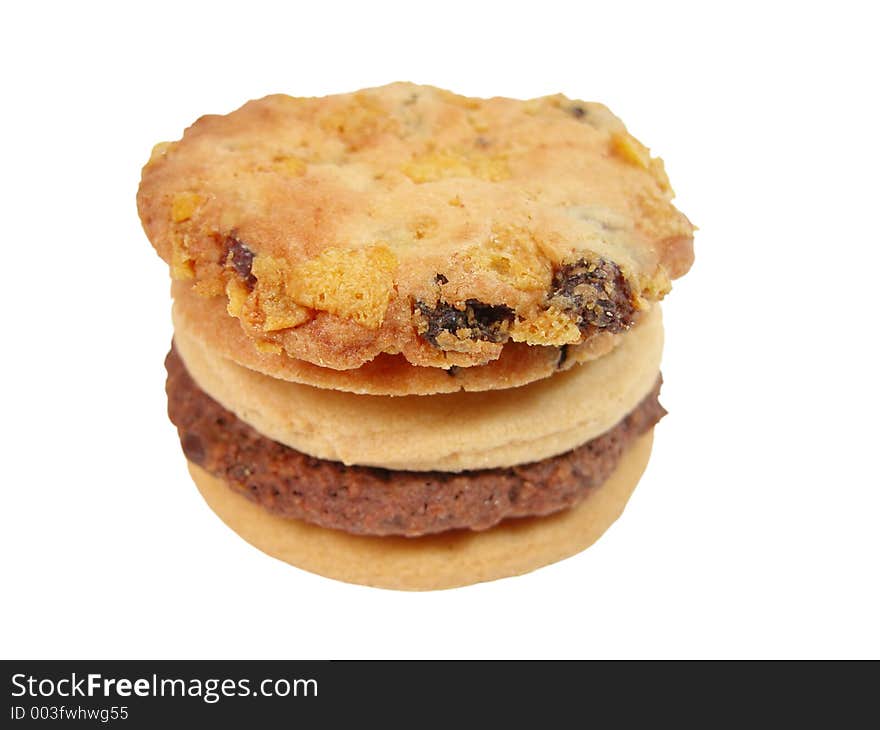 Stack of biscuits isolated over white background with clipping path.Selective focus on the margin of the top biscuit. Stack of biscuits isolated over white background with clipping path.Selective focus on the margin of the top biscuit.