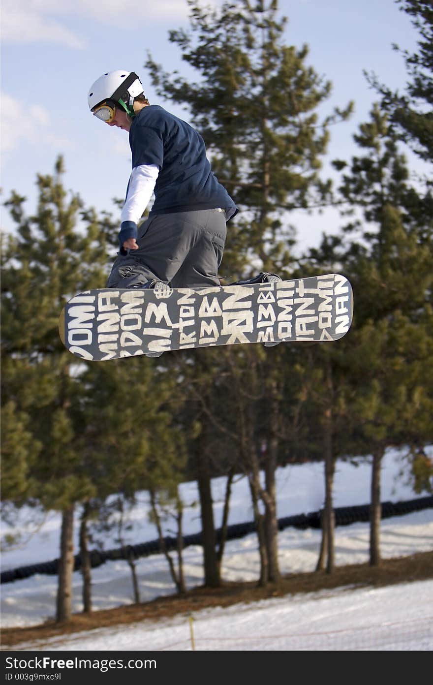 Snowboarder Launching off Jump