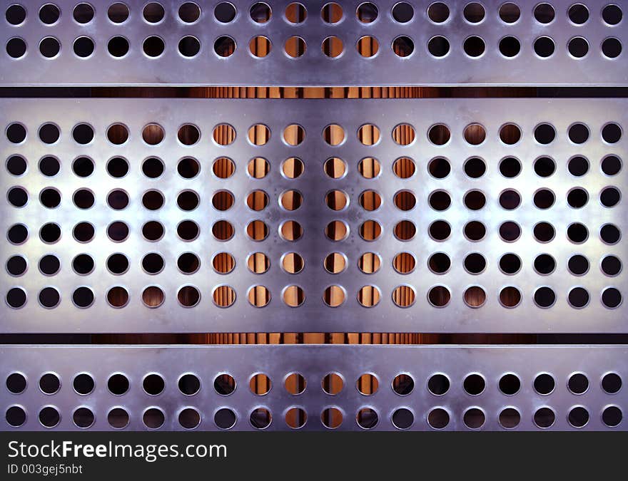 Close-up of sheet of metal with holes in urban building. Close-up of sheet of metal with holes in urban building