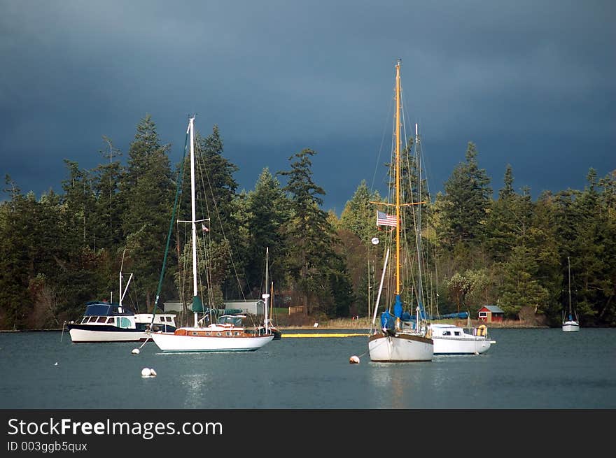 Sailboats in the harbor on a stormy day