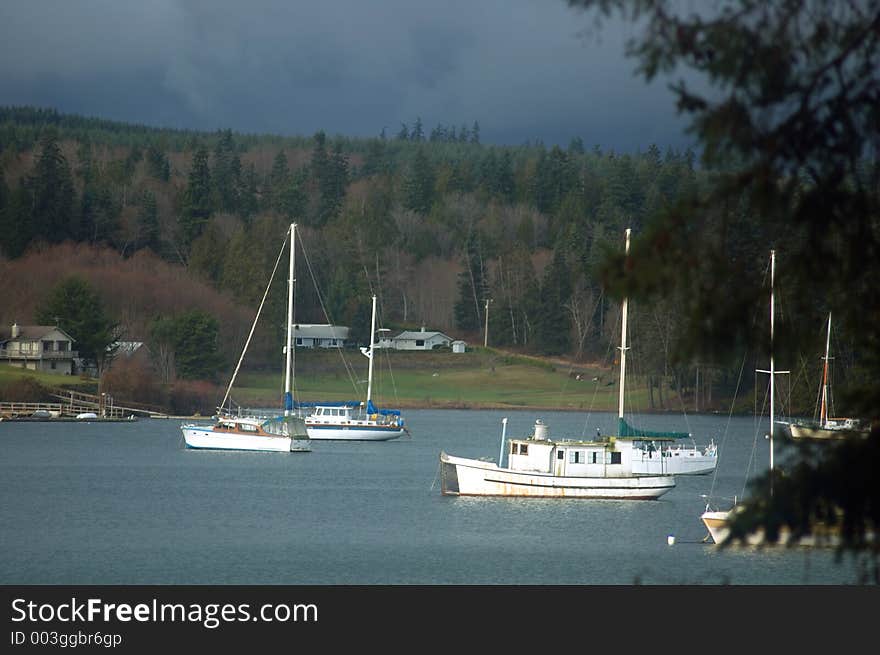 Sailboats in the harbor on a stormy day