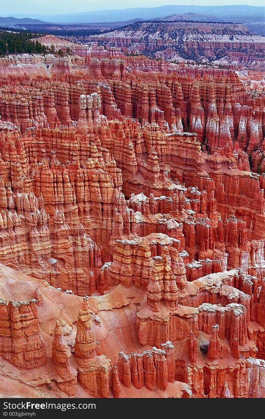 Bryce canyon view - total. A fantastic Orange city sprinkled with snow in the mountains of Utah... A spectrum of colors - orange to blue