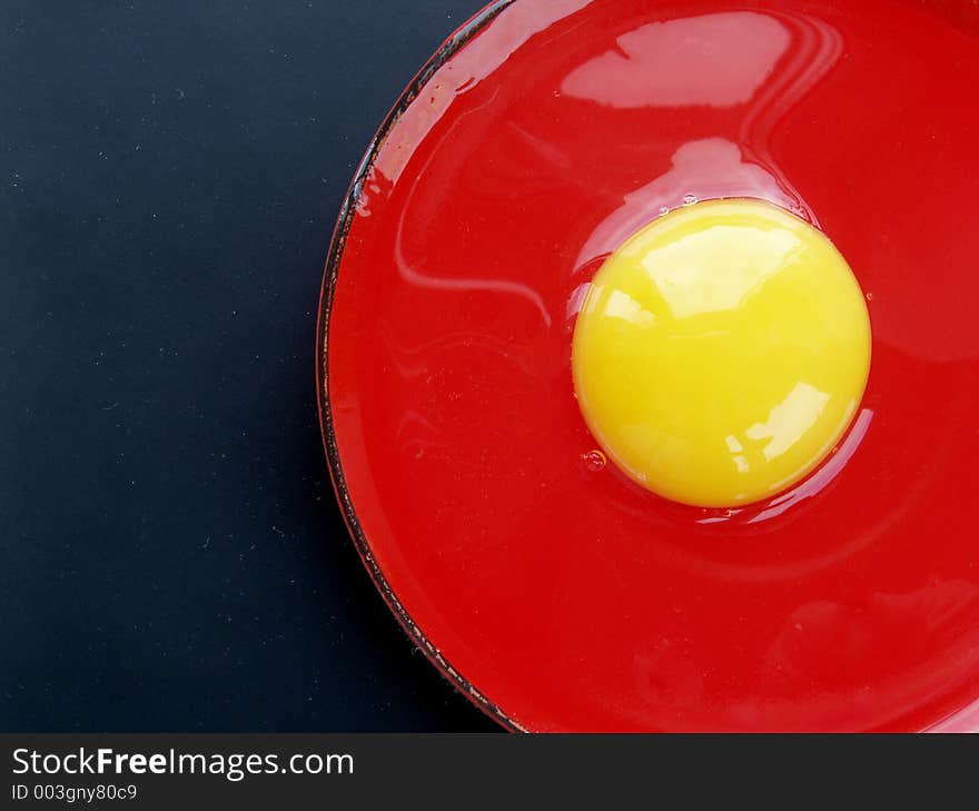 Still life with egg on red and black colours. Still life with egg on red and black colours