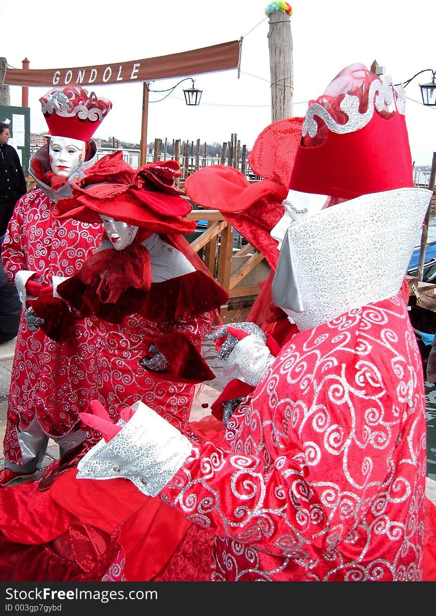 A group of masks representing a garden of roses. An image taken in venice during the 2006 carnival. A group of masks representing a garden of roses. An image taken in venice during the 2006 carnival.