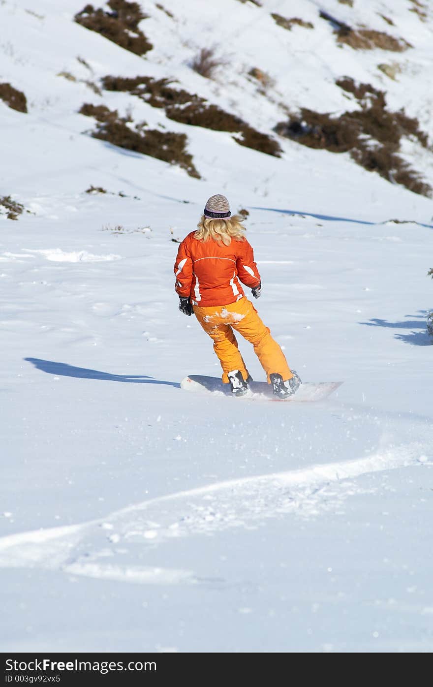 Orange snowboard girl downhill...