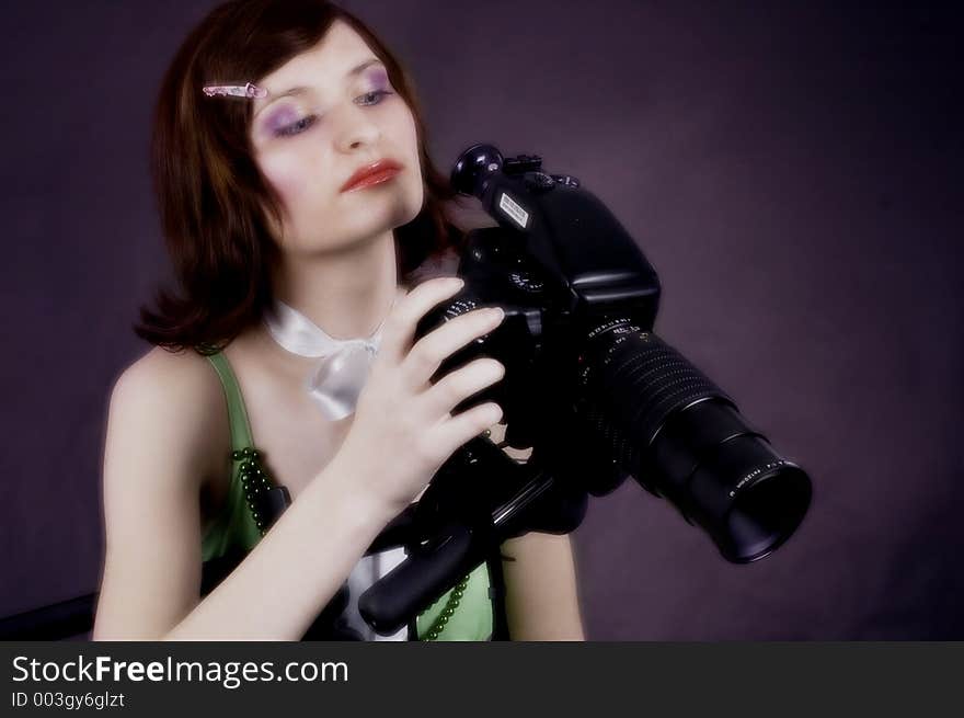 Woman with a studio camera. Woman with a studio camera