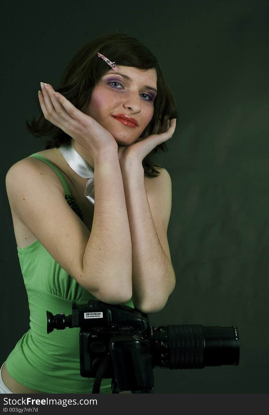 Young woman and studio camera. Young woman and studio camera