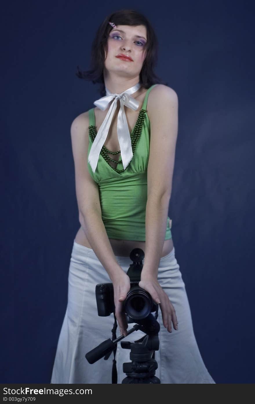 Young woman with studio camera. Young woman with studio camera