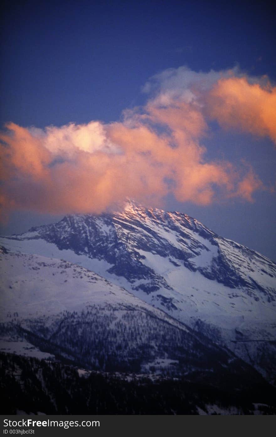 Sunset in the alps with red clouds