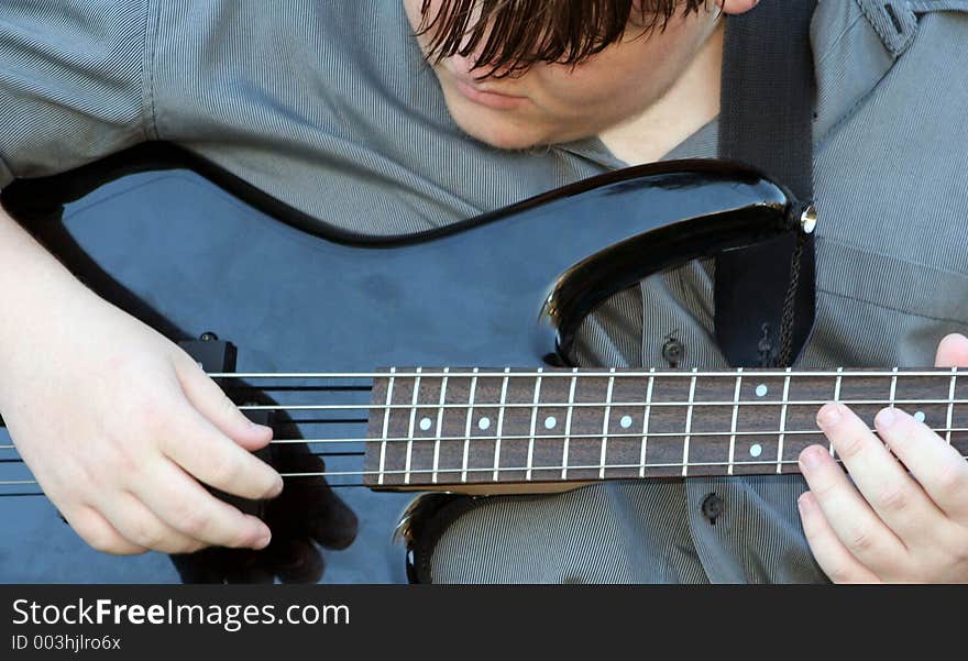 Teenage Boy Playing Bass. Teenage Boy Playing Bass