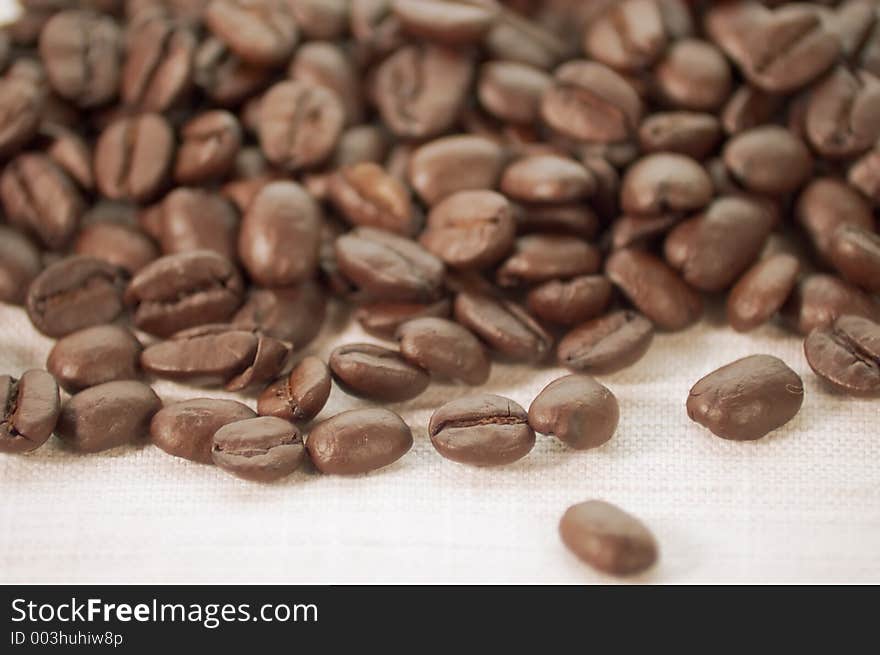 Pile of coffee beans on burlap cloth