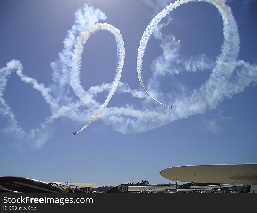 An airplane skywriting during an airshow