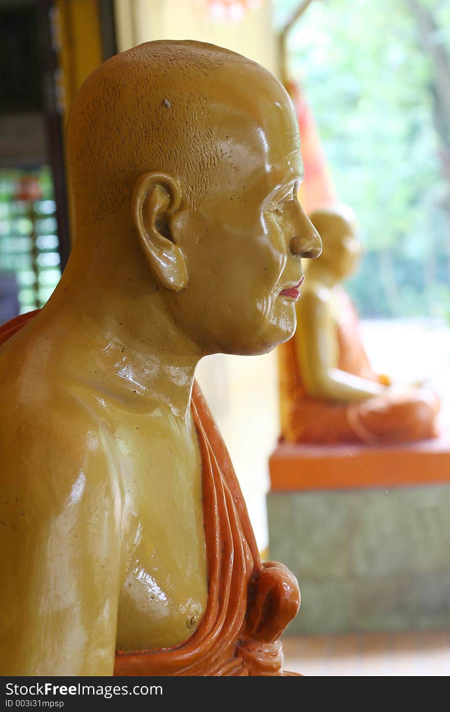 Statue of monks in a temple.