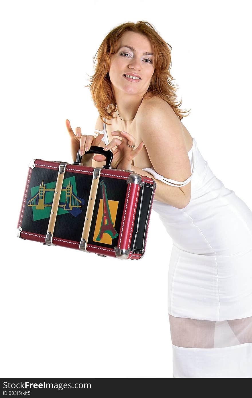 Funny retro portrait of a beautiful woman with old luggage. Funny retro portrait of a beautiful woman with old luggage