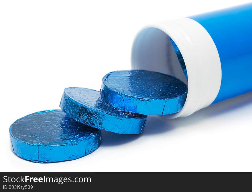 Tube of wrapped vitamin pills against a white background. Tube of wrapped vitamin pills against a white background.