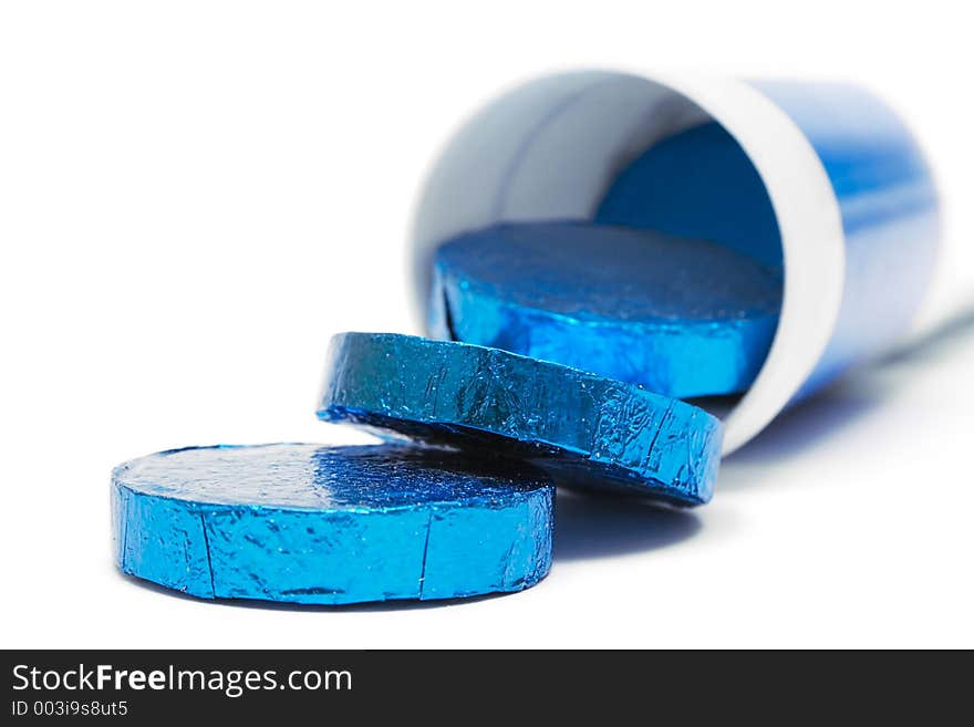 Tube of wrapped vitamin pills against a white background. Tube of wrapped vitamin pills against a white background.