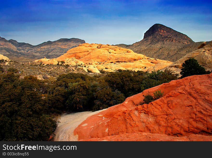 The Red Rock Canyon National Conservation Area is located just a few miles west of Las Vegas and encompasses 197,000 acres within the Mojave Desert.  Red Rock is an  area of world wide geologic interest and beauty. The most significant geologic feature of Red Rock Canyon is the Keystone Thrust Fault. A thrust fault is a fracture in the earth's crust where one rock plate is thrust horizontally over another. About 65 million years ago, it is believed that two of the earth's crustal plates collided with such force that part of one plate was shoved up and over younger sandstones. This thrust contact is clearly defined by the sharp contrast between the grey limestones and the red sandstones. The Keystone Thrust Fault extends from the Cottonwoood Fault (along the Pahrump Highway) 13 miles northward to the vicinity of La Madre Mountain, where it is obscured by more complex faulting. The Red Rock Canyon National Conservation Area is located just a few miles west of Las Vegas and encompasses 197,000 acres within the Mojave Desert.  Red Rock is an  area of world wide geologic interest and beauty. The most significant geologic feature of Red Rock Canyon is the Keystone Thrust Fault. A thrust fault is a fracture in the earth's crust where one rock plate is thrust horizontally over another. About 65 million years ago, it is believed that two of the earth's crustal plates collided with such force that part of one plate was shoved up and over younger sandstones. This thrust contact is clearly defined by the sharp contrast between the grey limestones and the red sandstones. The Keystone Thrust Fault extends from the Cottonwoood Fault (along the Pahrump Highway) 13 miles northward to the vicinity of La Madre Mountain, where it is obscured by more complex faulting.