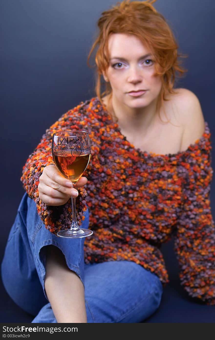 Beautiful red haired lady with glass of red wine in her hand. Beautiful red haired lady with glass of red wine in her hand