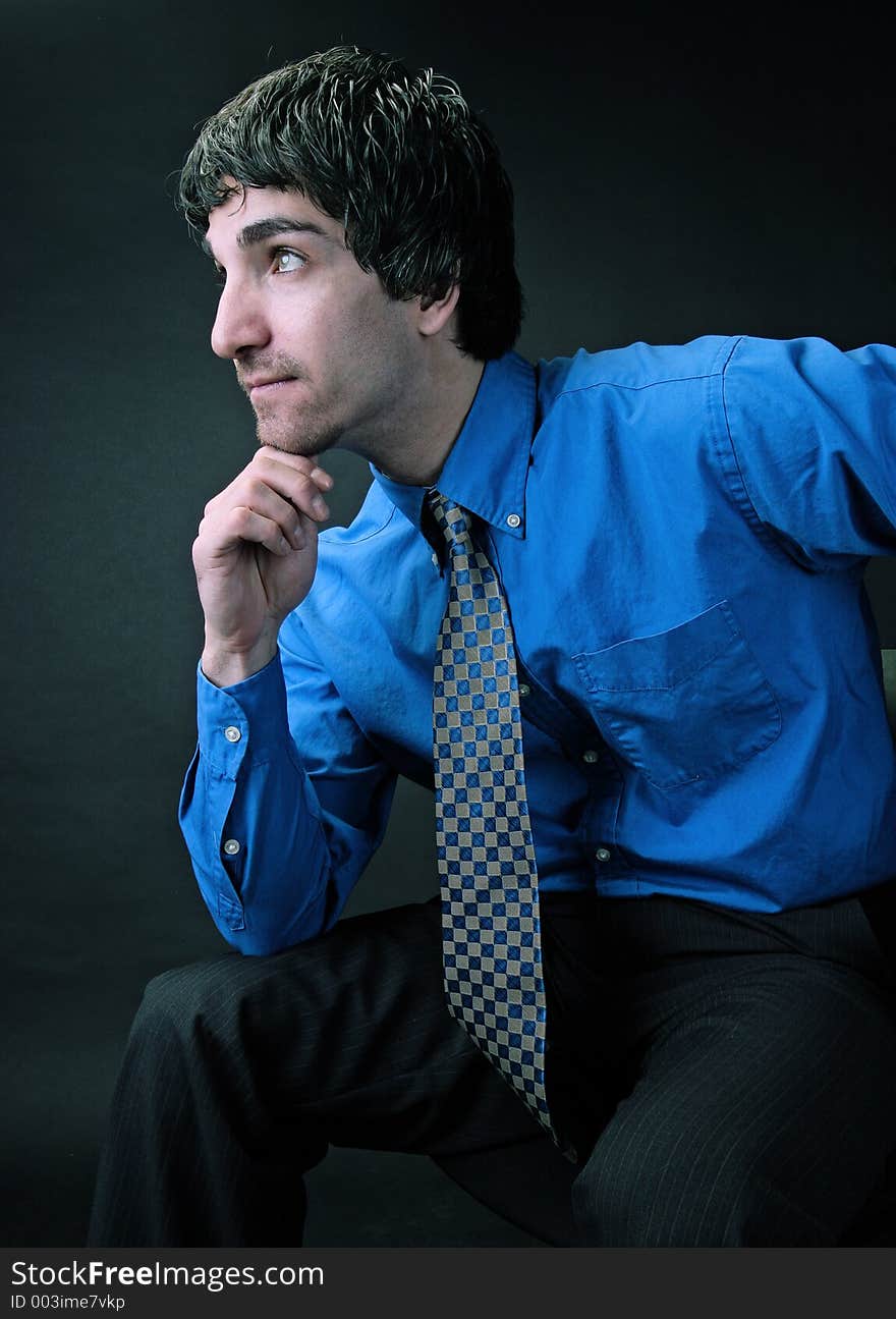 Businessman portrait looking away from the camera thinking