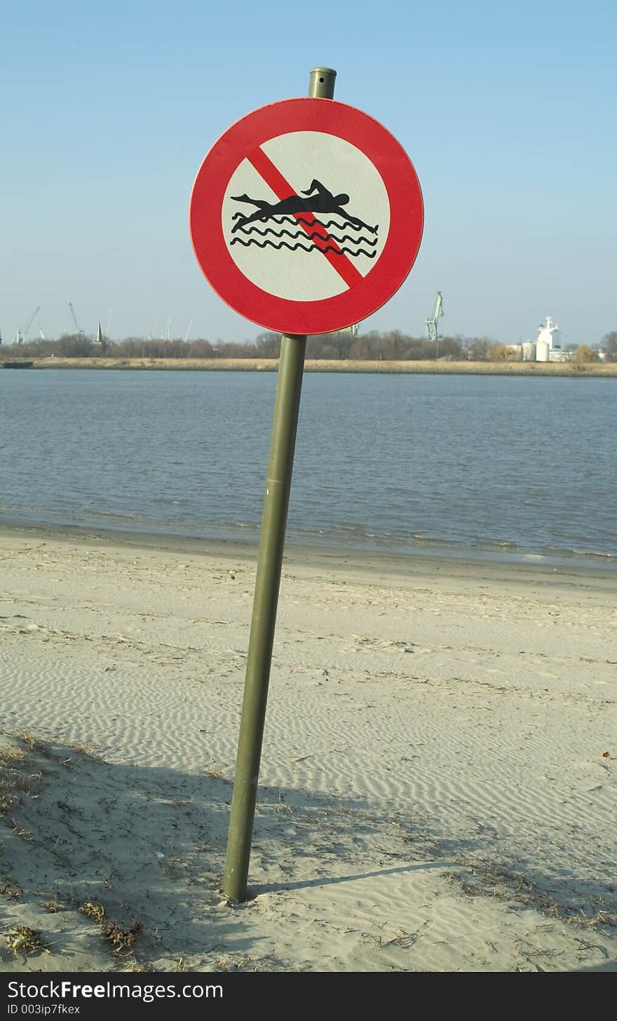 Sign on the left bank of the river Scelde (Antwerp, Belgium) : forbidden to swim. Sign on the left bank of the river Scelde (Antwerp, Belgium) : forbidden to swim