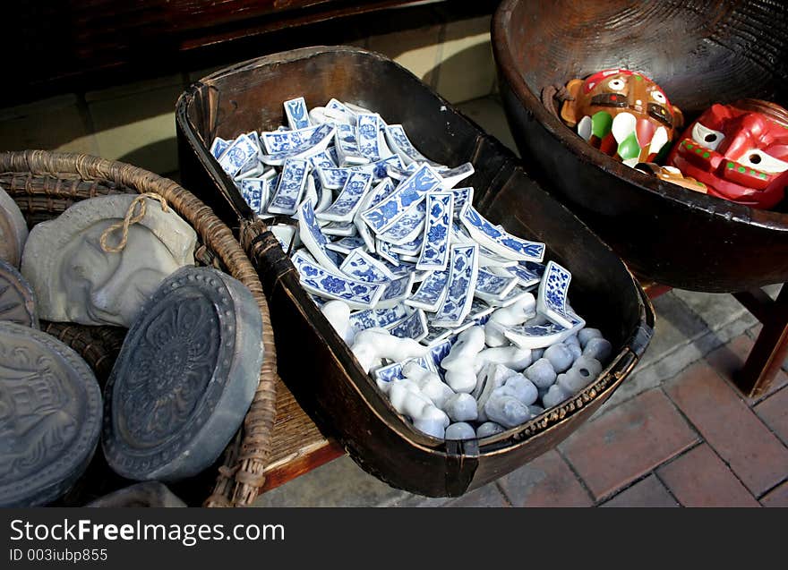 Bowls of Asian crafts including blue crockery chopstick rests