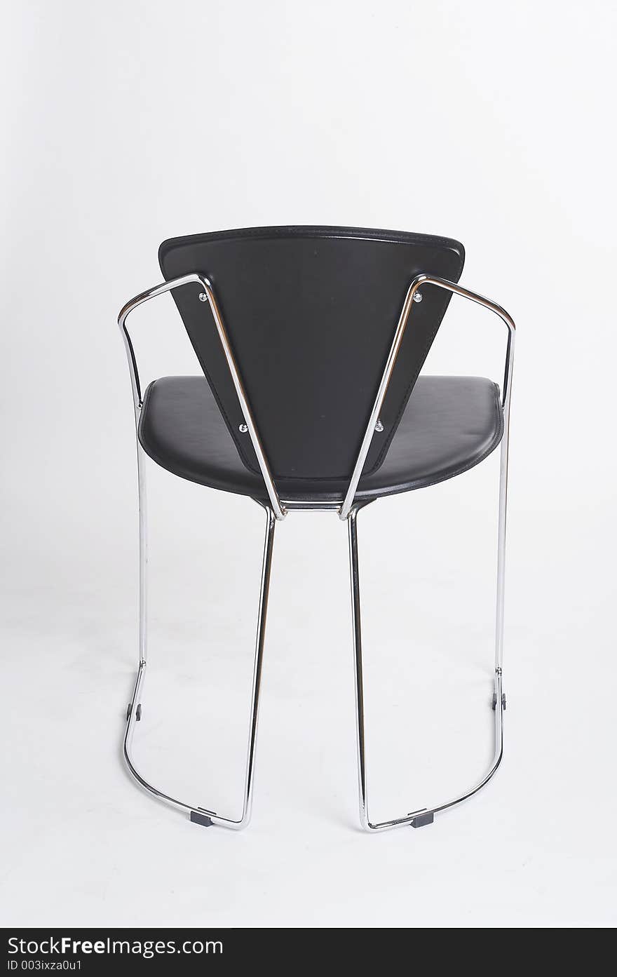 Black metal chair on white background - schwarzer Metallstuhl vor weissem Hintergrund. Black metal chair on white background - schwarzer Metallstuhl vor weissem Hintergrund