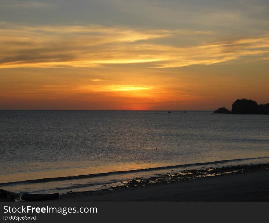 Sun setting over ocean. Sun setting over ocean