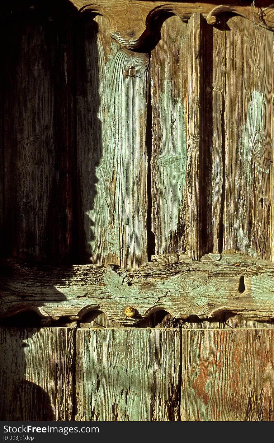 Old wooden door in Monregrazie, Italy