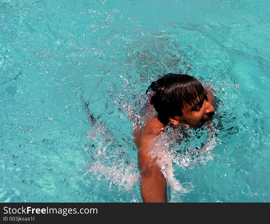 A swimmer reaching the post. A swimmer reaching the post.