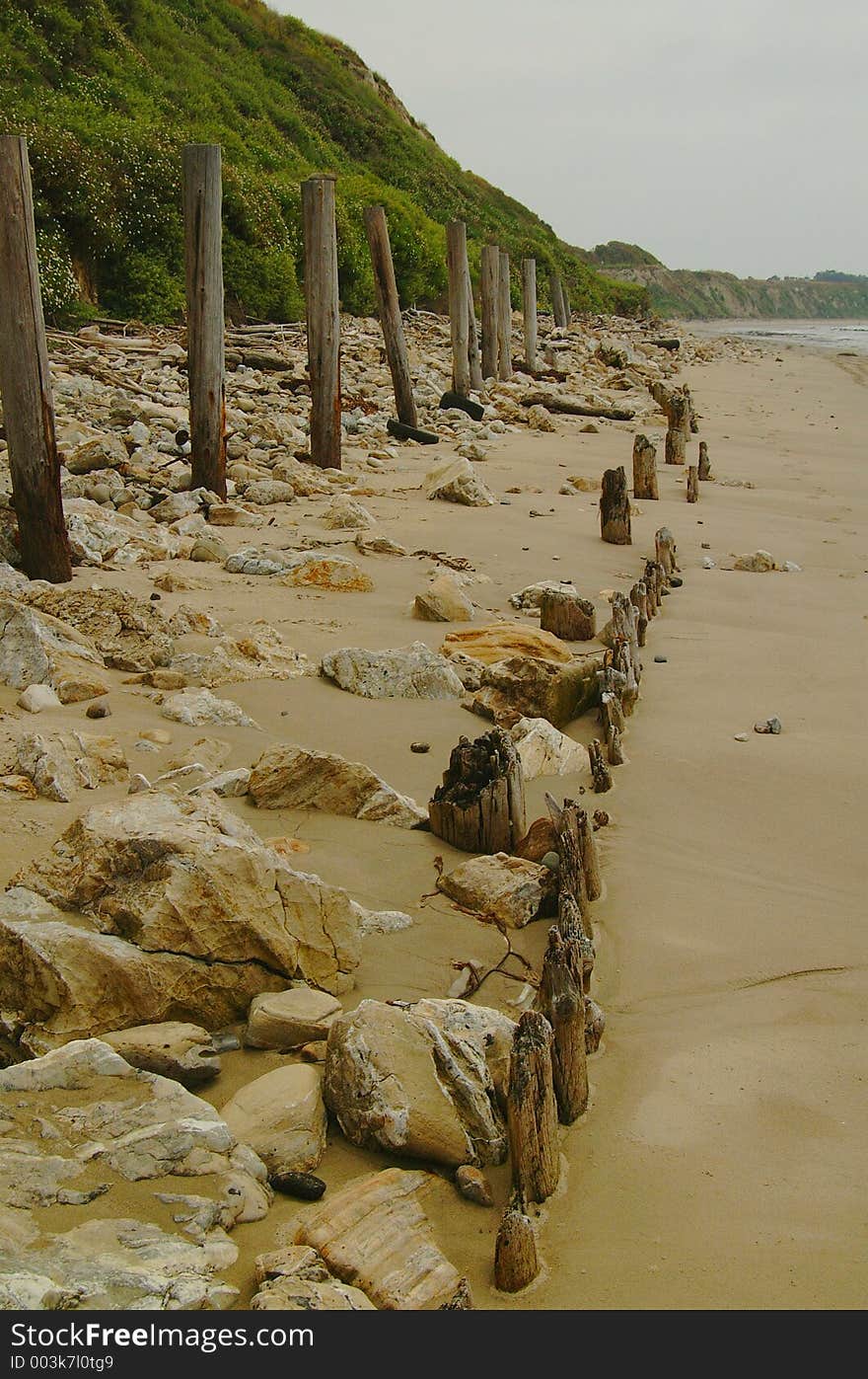 Fence Along Beach And Cliffs