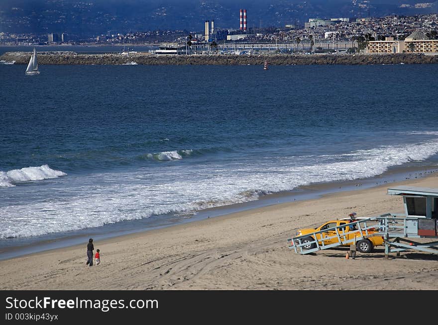 A high angle shot overlooking the shoreline of an ocean front industrial town. A high angle shot overlooking the shoreline of an ocean front industrial town.