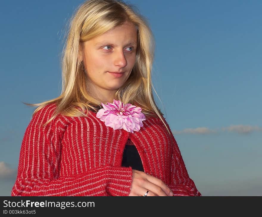 Woman with a flower, blue background. Woman with a flower, blue background.