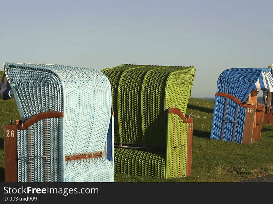 Arrangement of differently couloured beach chairs. Arrangement of differently couloured beach chairs