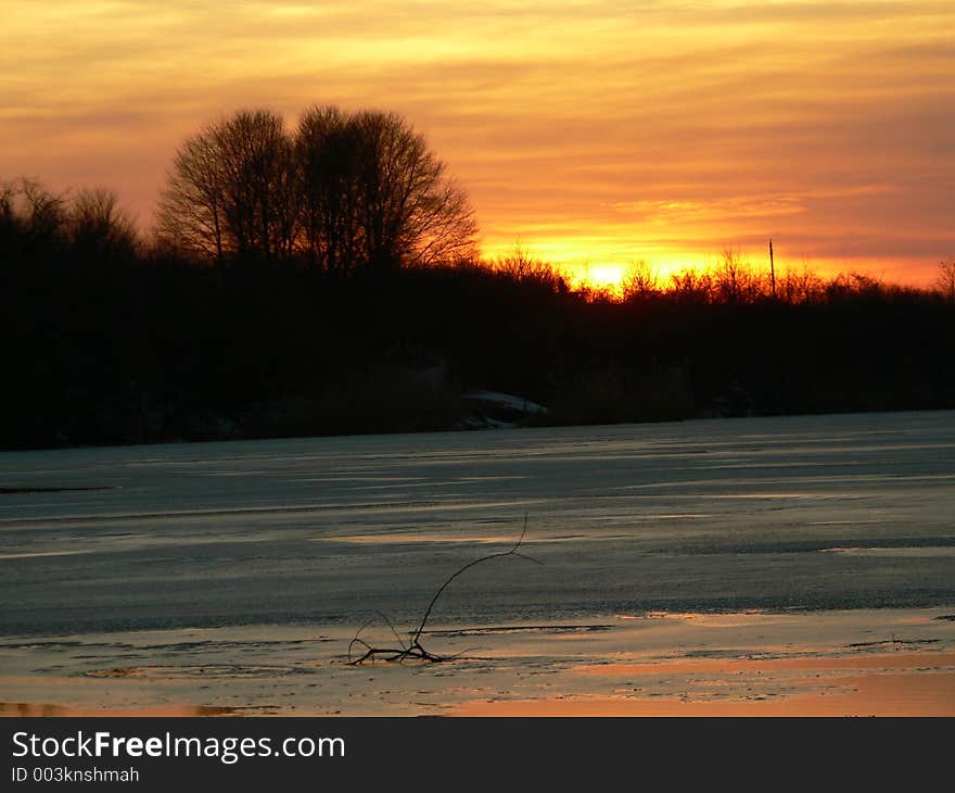 Sunset on a frozen lake