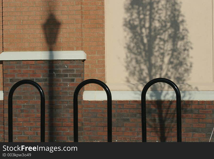 Black bars against wall with shadows. Black bars against wall with shadows