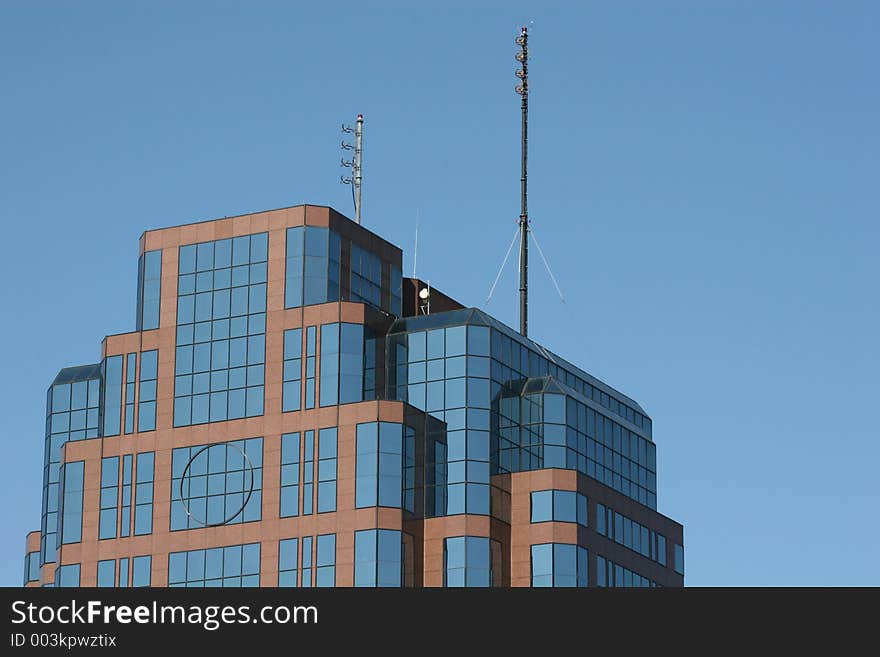 Brick and Glass office building against blue sky