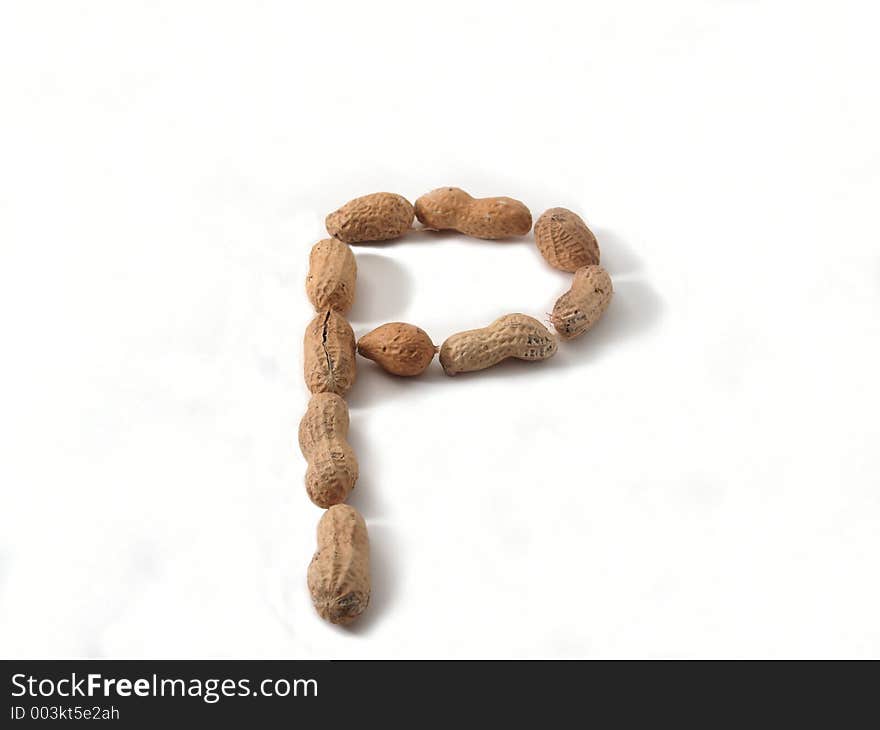 Letter P made of peanuts, on white background. Letter P made of peanuts, on white background