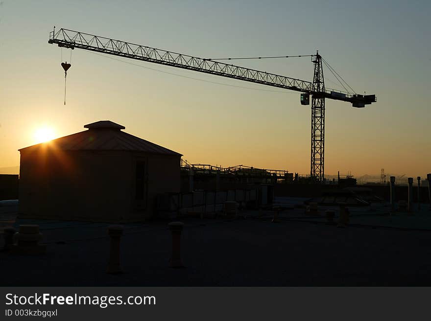 Crane and building at Sunset