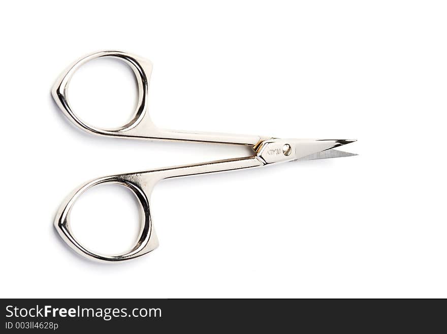 Top view of open scissors isolated on white. Focus is on the handles. Top view of open scissors isolated on white. Focus is on the handles