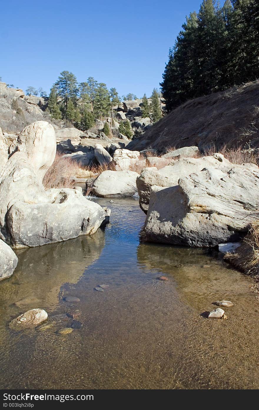 Cherry Creek makes its way through unusual rock formations in Castlewood Canyon of central Colorado. Cherry Creek makes its way through unusual rock formations in Castlewood Canyon of central Colorado.